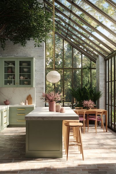 Cuisine moderne avec toit en verre, armoires vert sauge, comptoir en marbre, îlot central, coin repas et vue panoramique sur la forêt Source - Elevé Living Pinterest