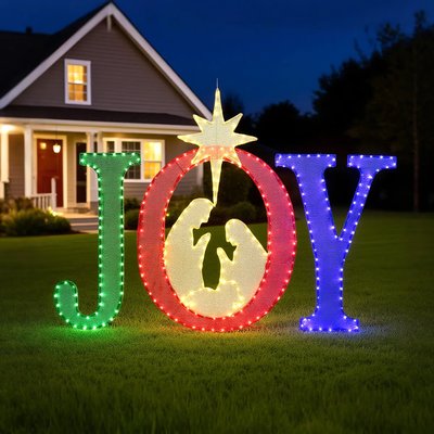 Décoration lumineuse de Noël formant le mot 'JOY' avec une crèche intégrée dans la lettre O, placée sur une pelouse devant une maison au crépuscule - Wayfair